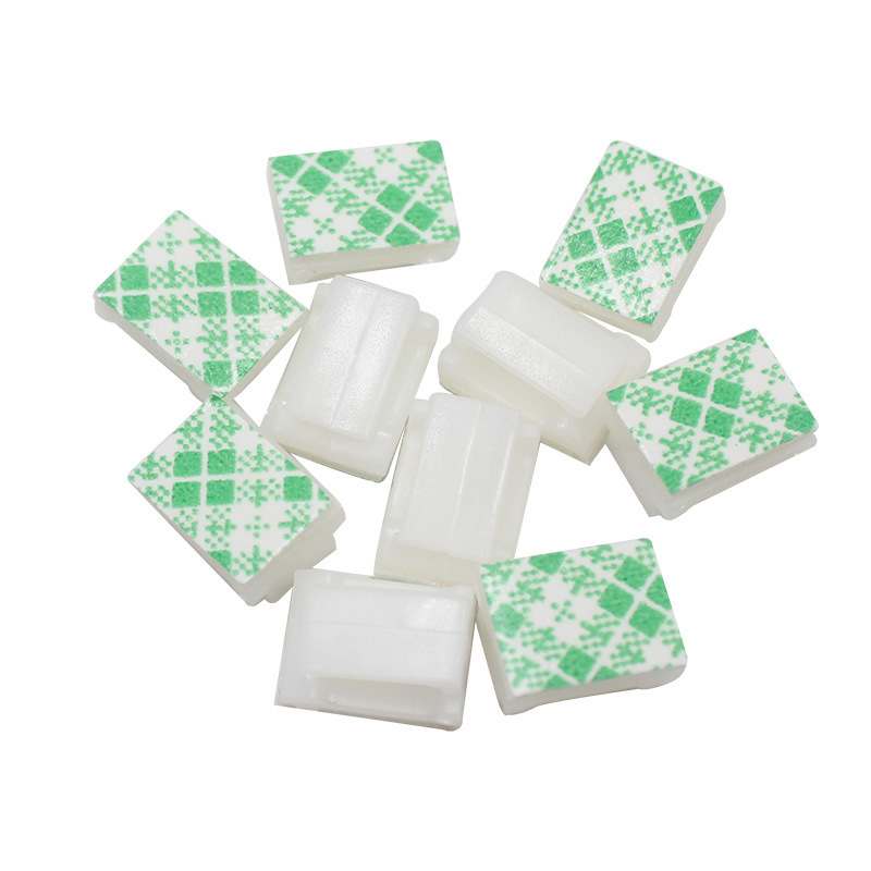Self-adhesive fixed line buckle