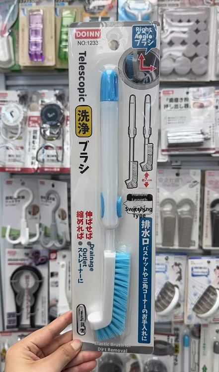 Drain outlet cleaning brush-retractable-blue and white-1 piece